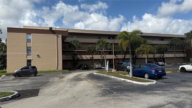 view of property with uncovered parking