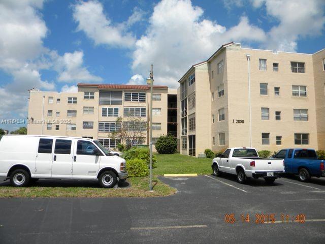 view of property with uncovered parking