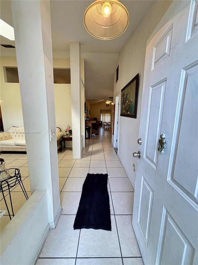 interior space featuring light tile patterned floors and visible vents