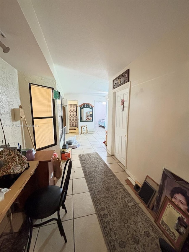 hallway with light tile patterned floors