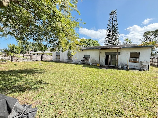 exterior space featuring cooling unit and fence