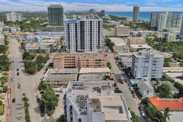 bird's eye view featuring a view of city and a water view