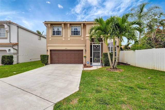 mediterranean / spanish-style home with stucco siding, a front lawn, fence, concrete driveway, and an attached garage