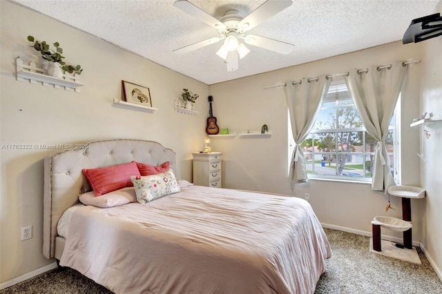 carpeted bedroom featuring ceiling fan, baseboards, and a textured ceiling