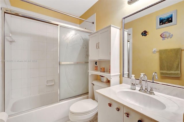 full bath with combined bath / shower with glass door, toilet, and vanity