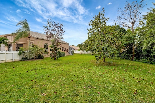 view of yard with fence