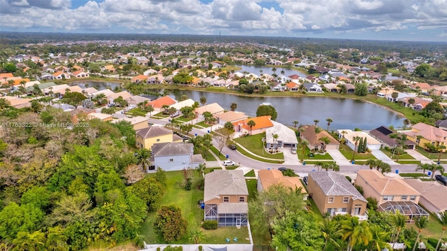 birds eye view of property with a residential view and a water view