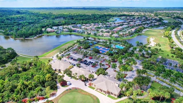 aerial view with a residential view and a water view