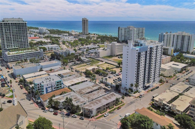 drone / aerial view with a view of city and a water view