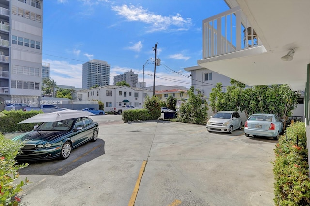 uncovered parking lot featuring a city view