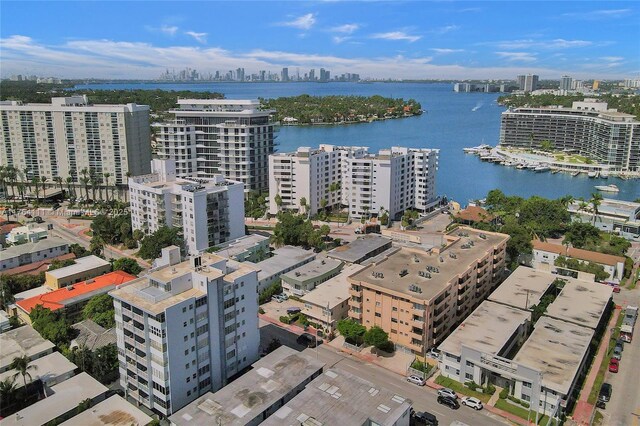 bird's eye view featuring a water view and a city view