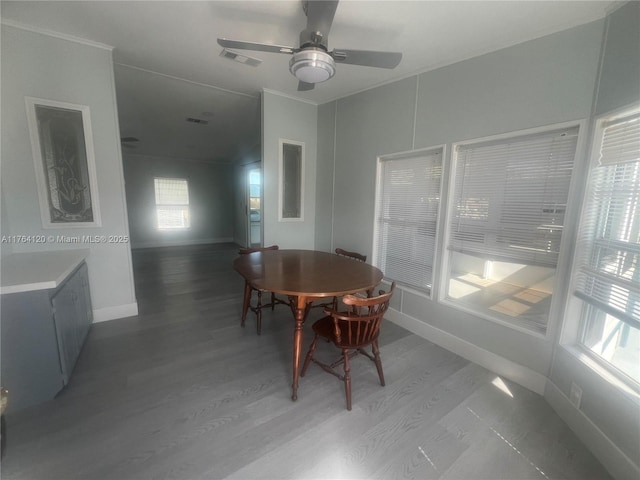 dining space with visible vents, a ceiling fan, light wood-type flooring, and baseboards