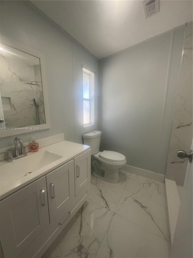 full bath with visible vents, baseboards, toilet, marble finish floor, and vanity