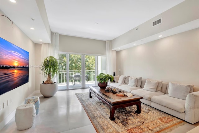 living room featuring recessed lighting and visible vents