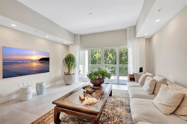 living area with recessed lighting and baseboards