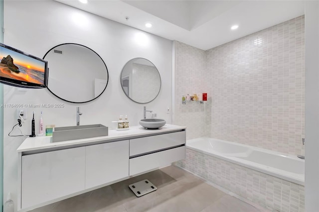 bathroom with double vanity, tile patterned flooring, recessed lighting, and a sink