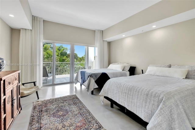 bedroom featuring recessed lighting, finished concrete flooring, and access to outside