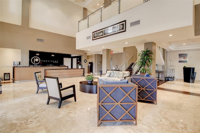 building lobby featuring visible vents and stairway