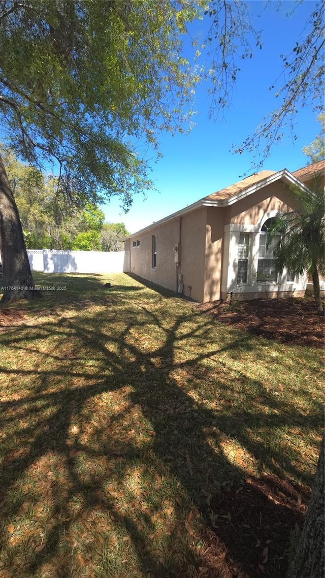 view of yard with fence