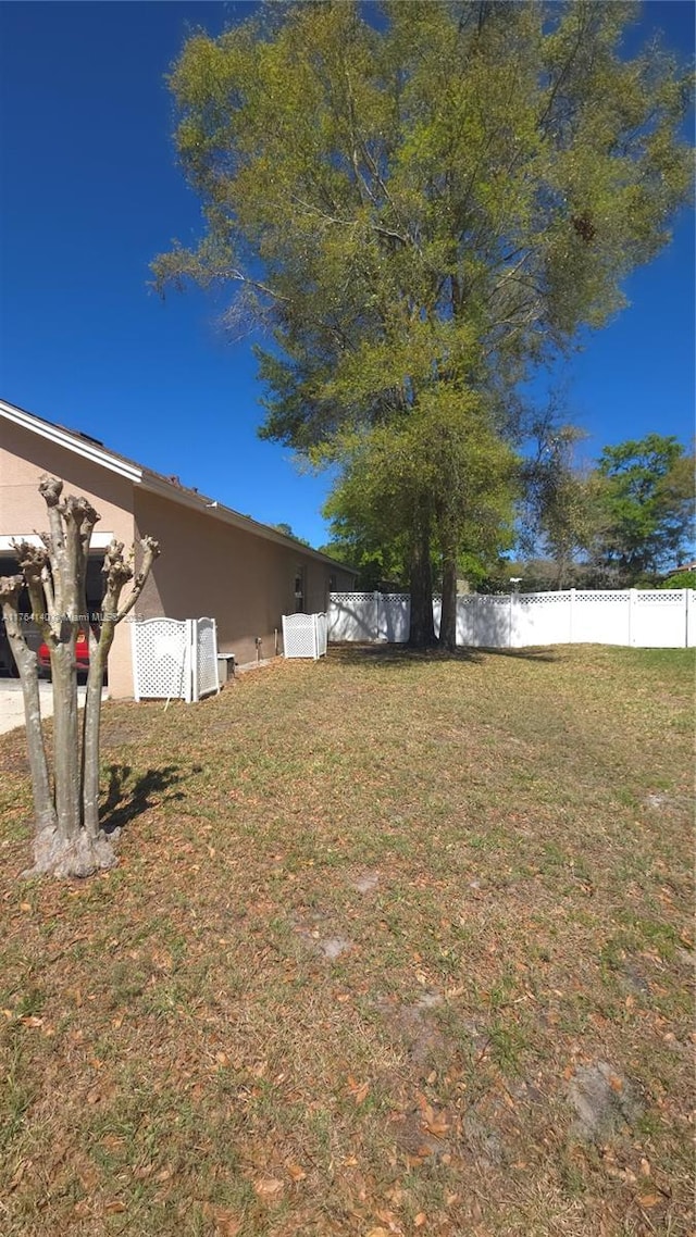 view of yard with fence