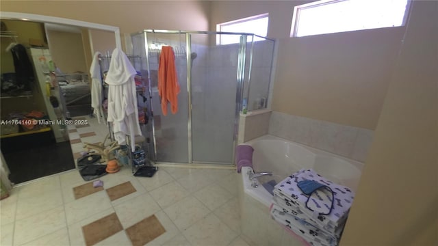 full bathroom with a bath and a shower stall