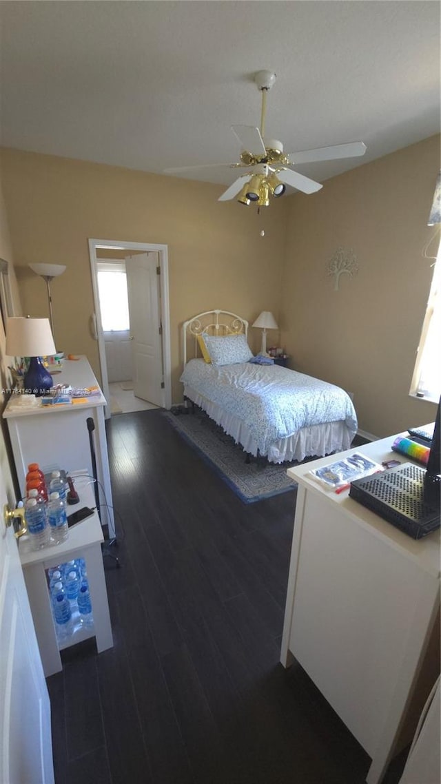 bedroom featuring wood finished floors and ceiling fan