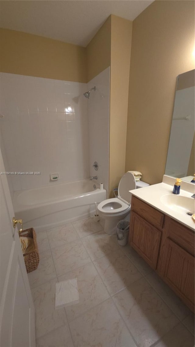 full bathroom with marble finish floor, vanity, toilet, and shower / bath combination