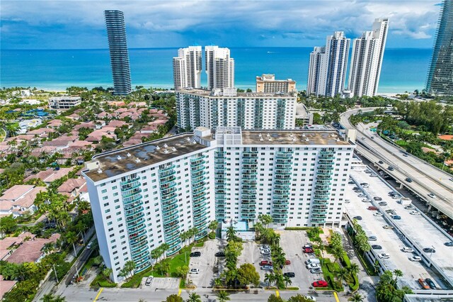 19380 Collins Ave Unit 307, Sunny Isles Beach, FL 33160 - exercise room with a paneled ceiling and baseboards