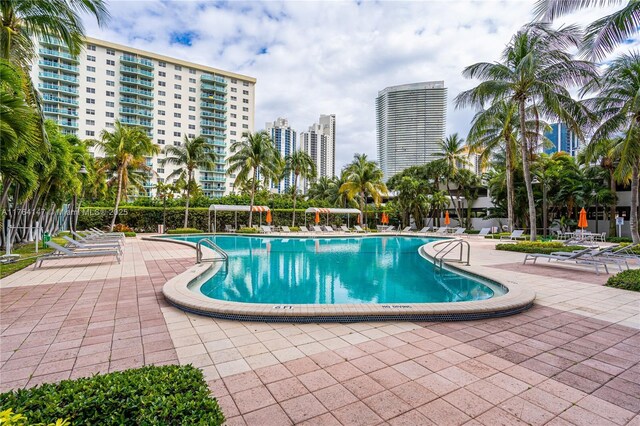 19380 Collins Ave Unit 307, Sunny Isles Beach, FL 33160 - community pool with a patio, a city view, and fence