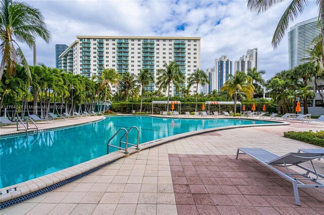 19380 Collins Ave Unit 307, Sunny Isles Beach, FL 33160 - community pool featuring a view of city and a patio