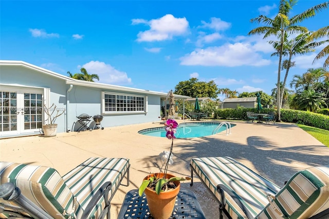 pool featuring a patio and french doors