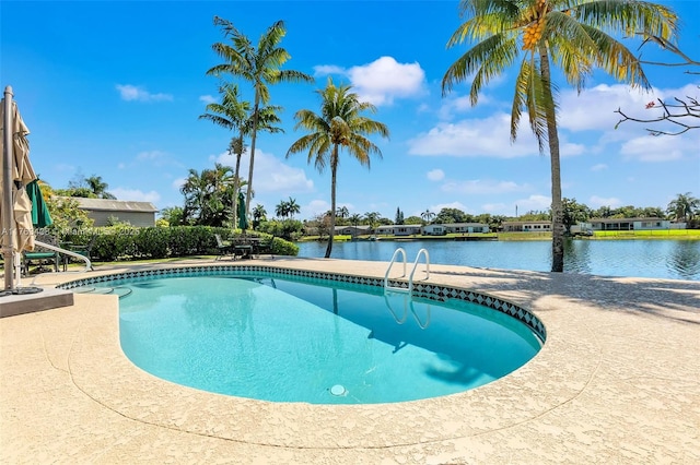 outdoor pool with a water view