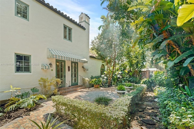 view of yard with french doors and a patio area