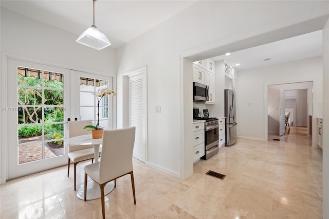 dining area with recessed lighting, visible vents, and baseboards