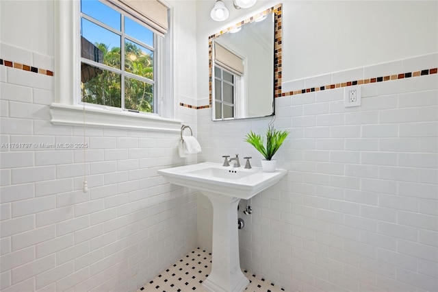 bathroom featuring tile walls and wainscoting