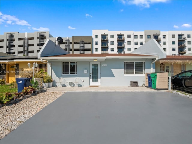 rear view of property with stucco siding