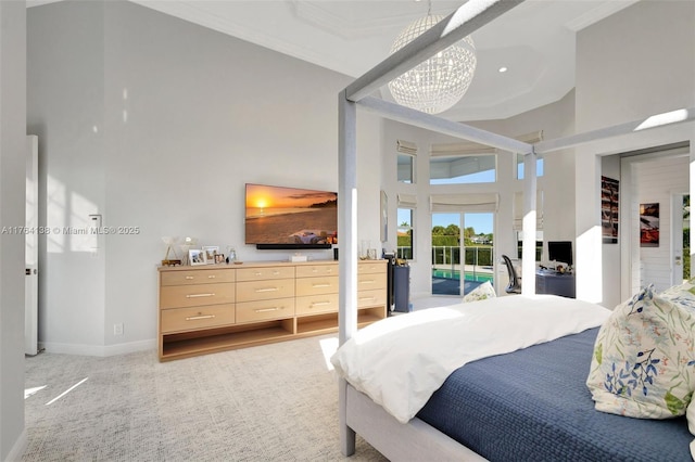 bedroom featuring light carpet, ornamental molding, a high ceiling, baseboards, and access to exterior