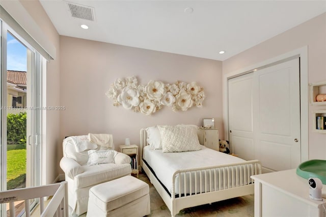 bedroom featuring recessed lighting, visible vents, and a closet