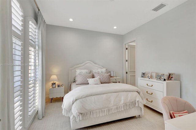 bedroom with recessed lighting and visible vents