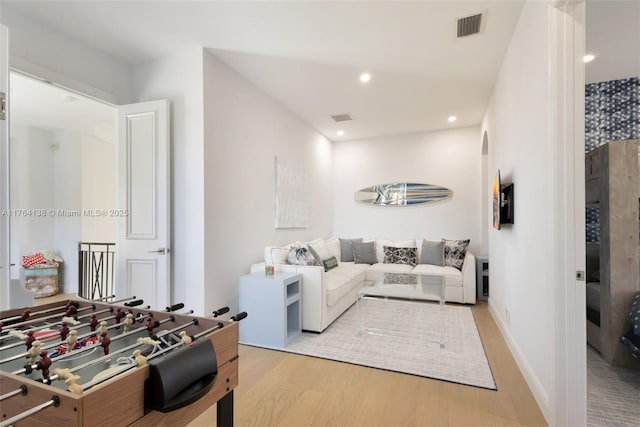 interior space featuring visible vents, recessed lighting, baseboards, and light wood-style floors