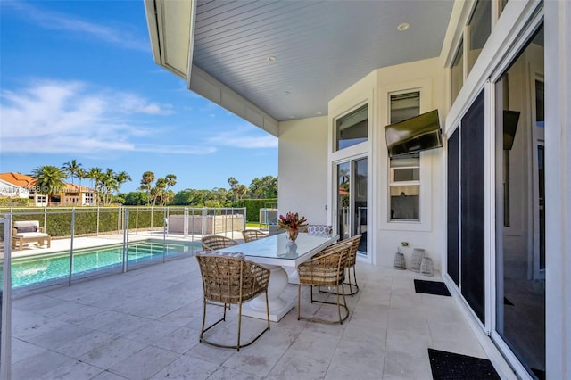 view of patio featuring a fenced in pool and fence