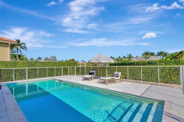 view of pool with a fenced in pool, a patio, and fence