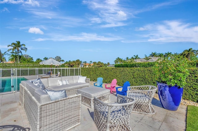 view of patio / terrace featuring a fenced in pool, outdoor lounge area, and fence