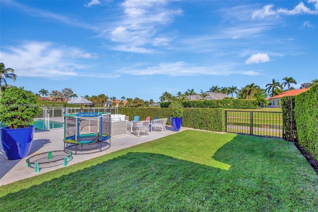 view of yard featuring a patio area, a fenced in pool, and a fenced backyard