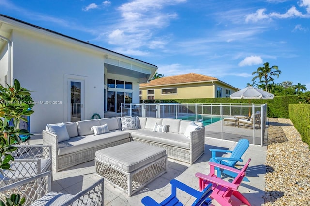 view of patio featuring a fenced in pool, outdoor lounge area, and fence