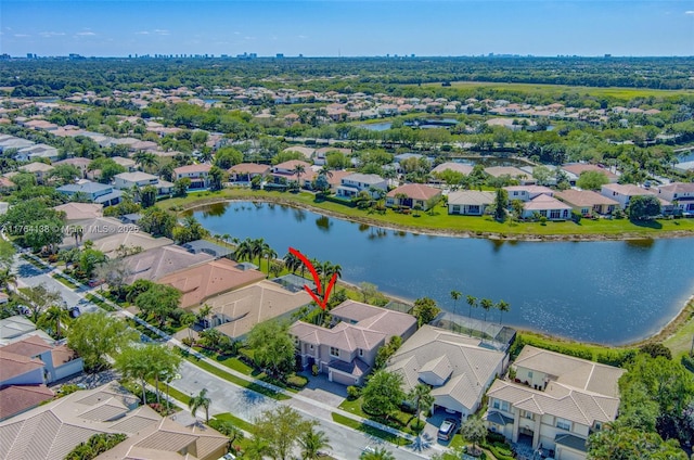 bird's eye view featuring a residential view and a water view