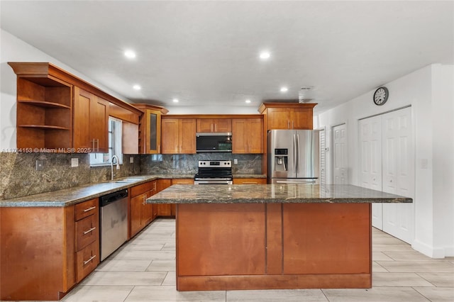 kitchen with a kitchen island, open shelves, a sink, decorative backsplash, and stainless steel appliances