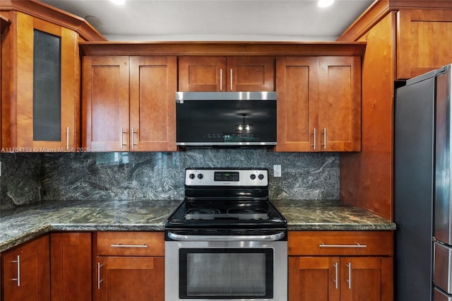 kitchen featuring stainless steel appliances, tasteful backsplash, and brown cabinetry