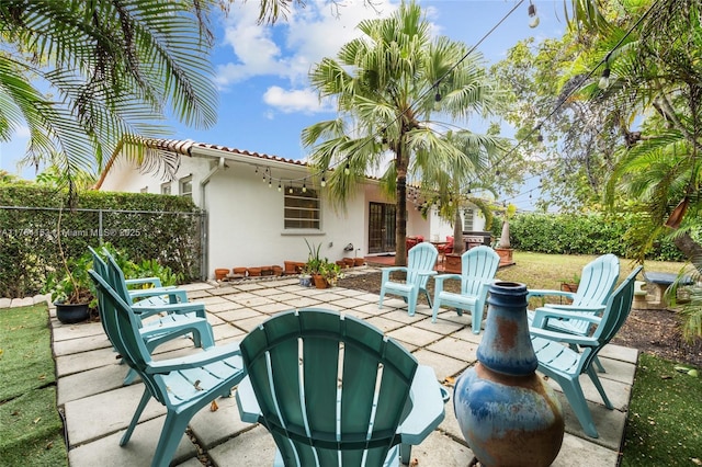 view of patio / terrace featuring fence