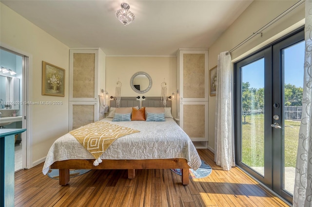 bedroom with hardwood / wood-style floors, access to outside, french doors, and baseboards